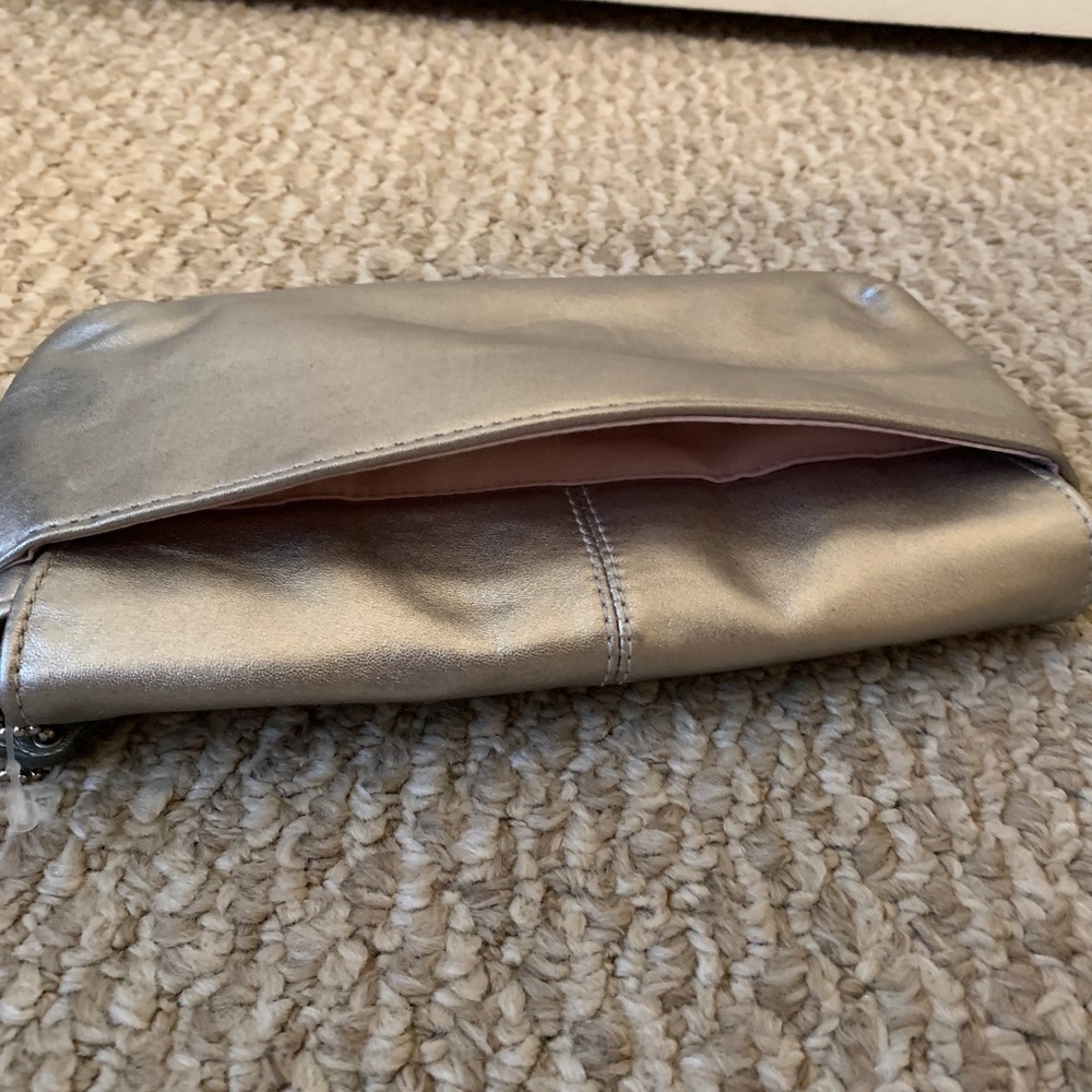 Never used Coach large flap wristlet. - Picture 6 of 7